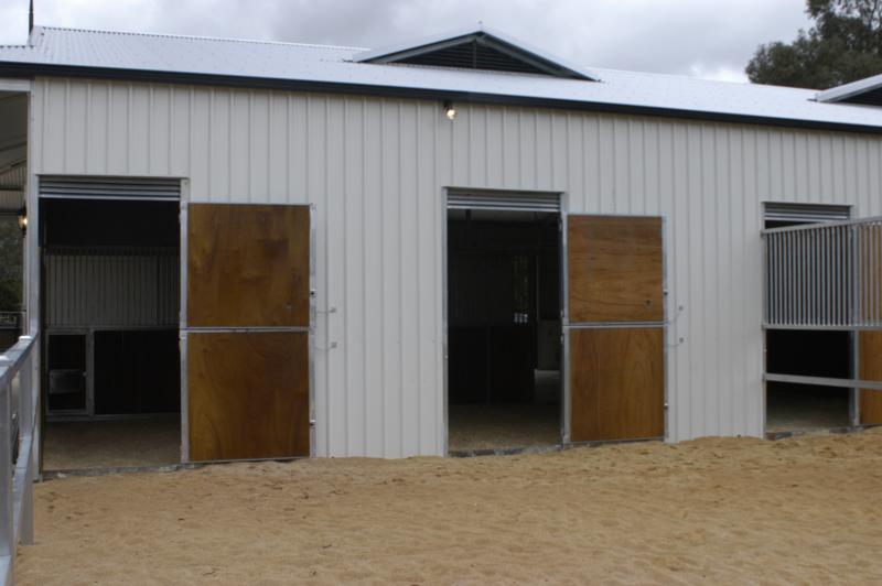 Double barn doors wood housed in a steel frame to yards