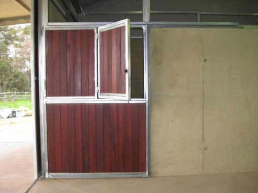 Double jarrah door with top door opening to one side for a teasing
