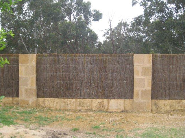 Brush wood and limestone fence