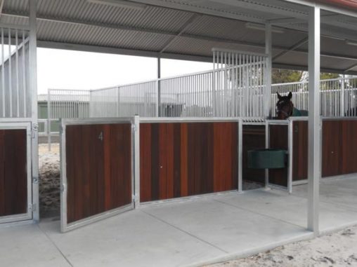 Front of stables steel bars with return open front